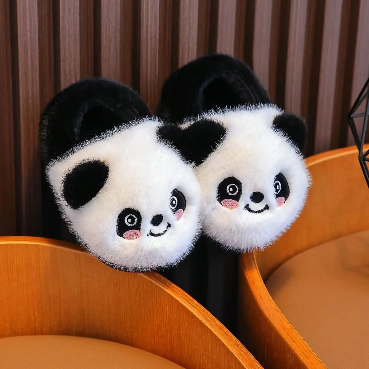 Front view of kids panda plush slippers with embroidered happy face