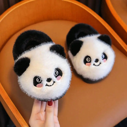 Fluffy panda slippers for kids held in hand