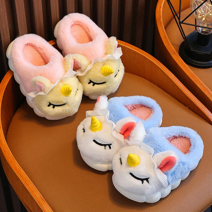 Kids unicorn plush slippers in blush pink and sky blue with sleepy eyes