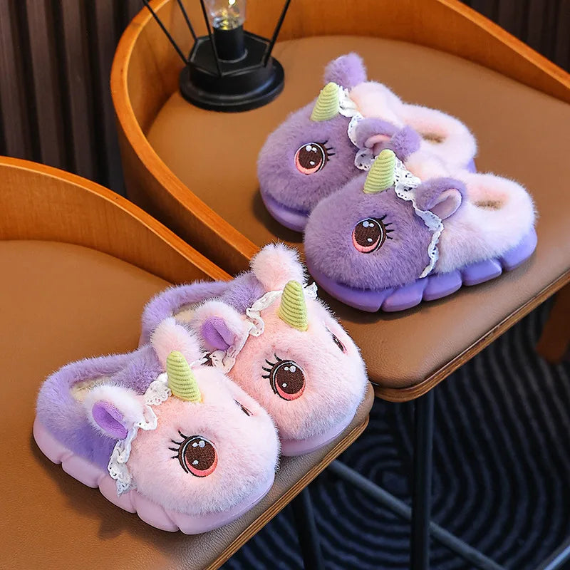 Two pairs of fluffy kids unicorn slippers in pink and lavender
