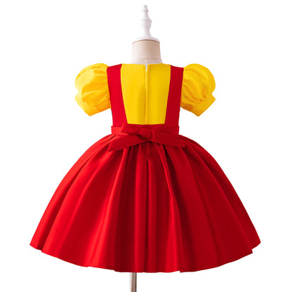 Girl in colorful puppet-inspired costume dress with puff sleeves and full twirl skirt
