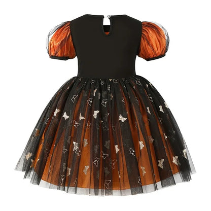 Twirly orange puff-sleeve costume dress for little witches by Magic Tree Kids