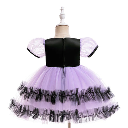 Purple toddler witch costume dress with puffed sleeves and spooky-cute print