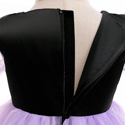 Playful purple witch dress showing the flared twirl skirt