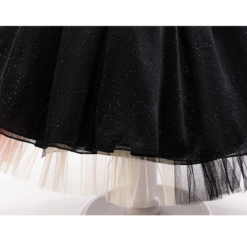 Young witch costume with sweeping cloak and magic wand accessory