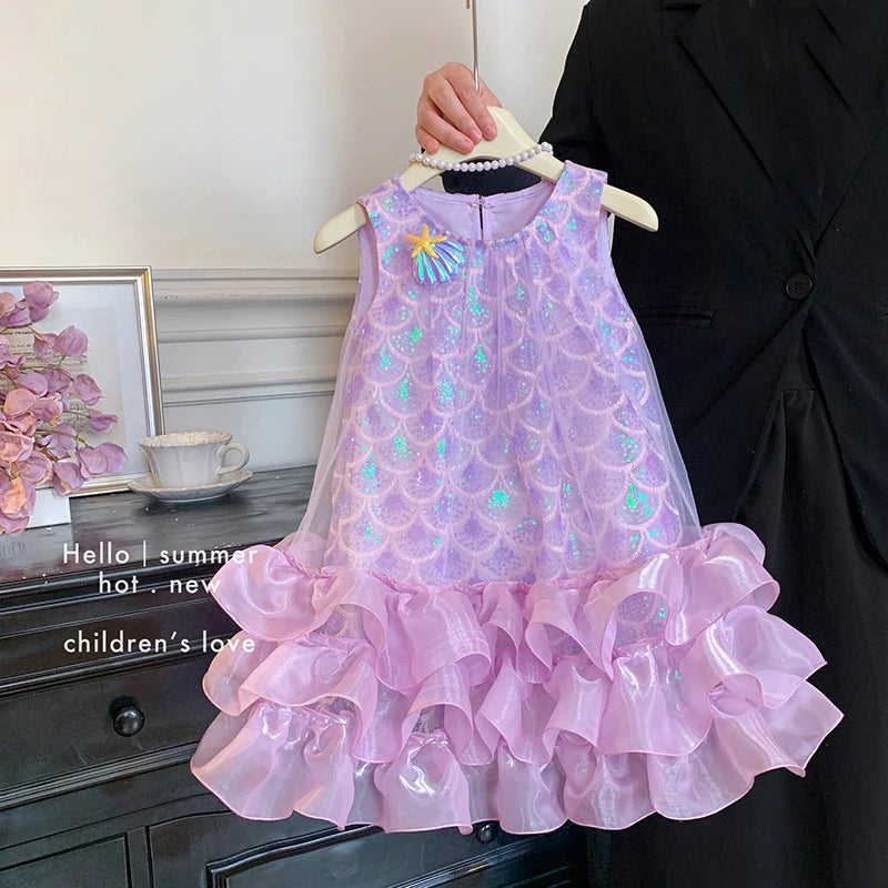 Close-up of the shimmering scale-effect detail on the girls' princess dress