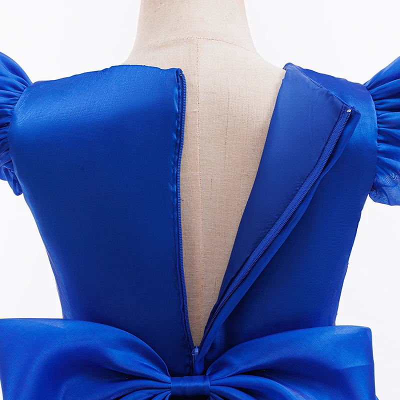 Girl twirling in a blue puppy patrol tutu party dress