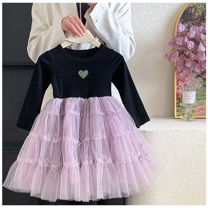 Close-up of the flowing purple mesh layers on the girls' dress