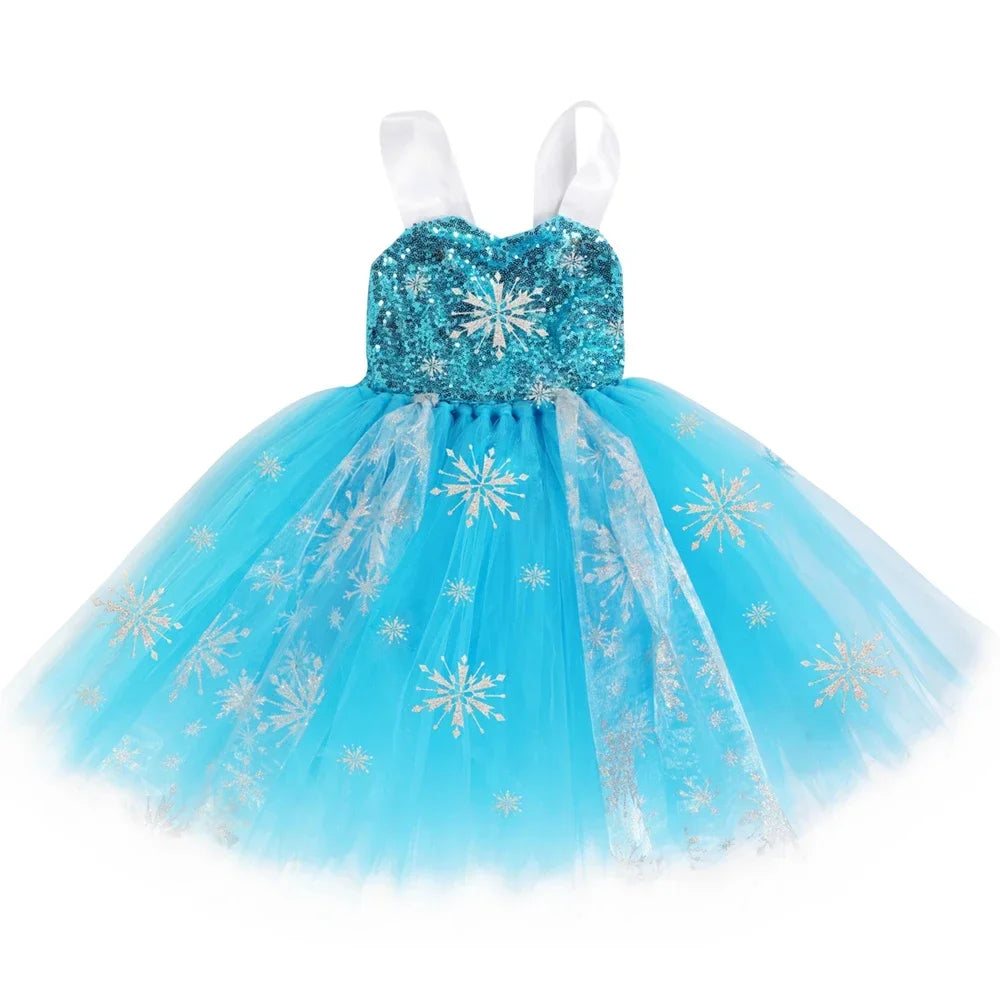 Little girl twirling in a sparkling winter princess gown