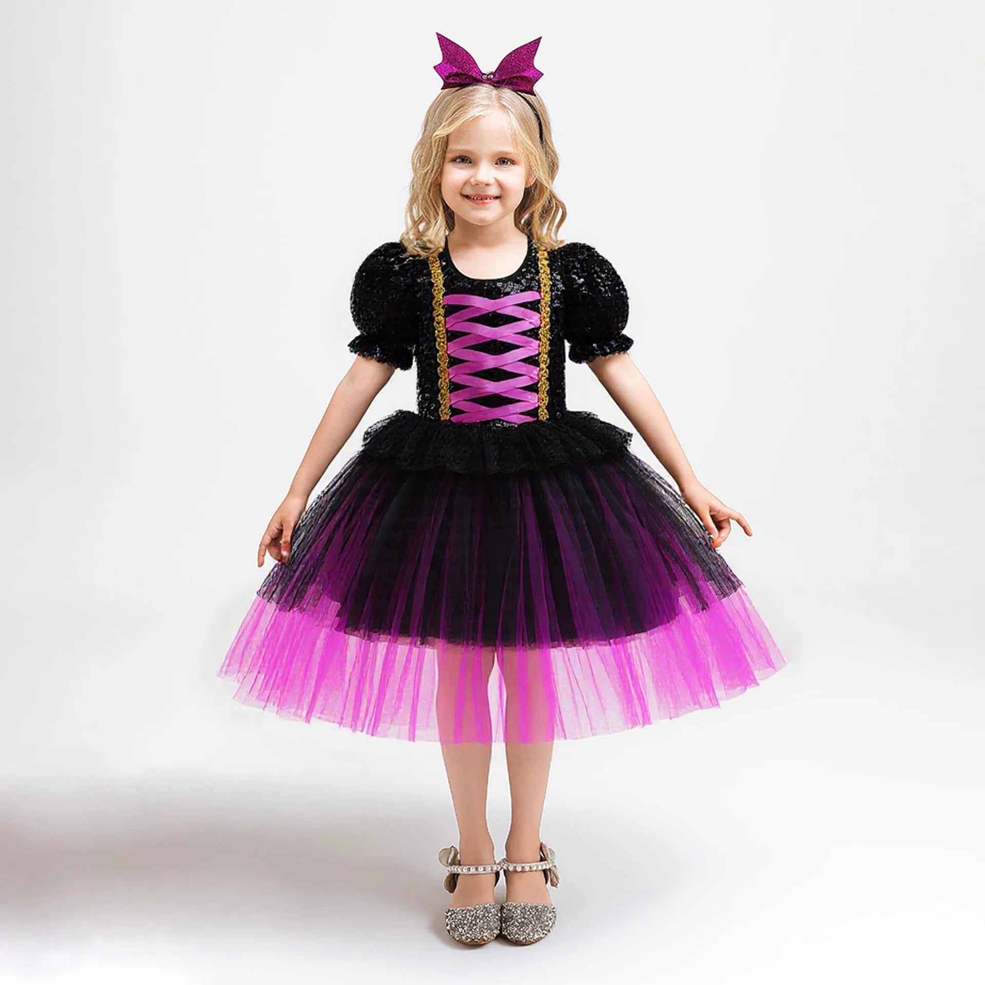 Little girl's twirling purple witch tutu dress with butterfly motif