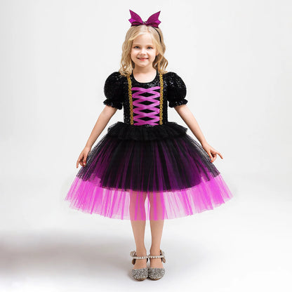 Little girl's twirling purple witch tutu dress with butterfly motif
