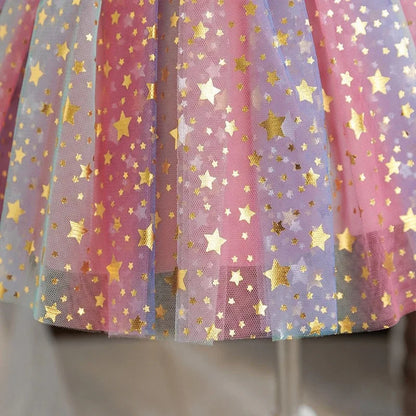 Shoulderless neckline and bow detail on girls' sequin party dress