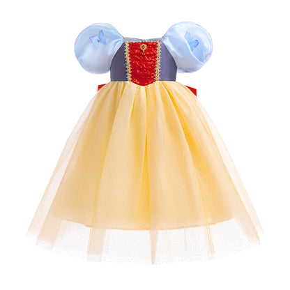 Little girl twirling in classic princess ball gown with fluttering butterfly sleeves