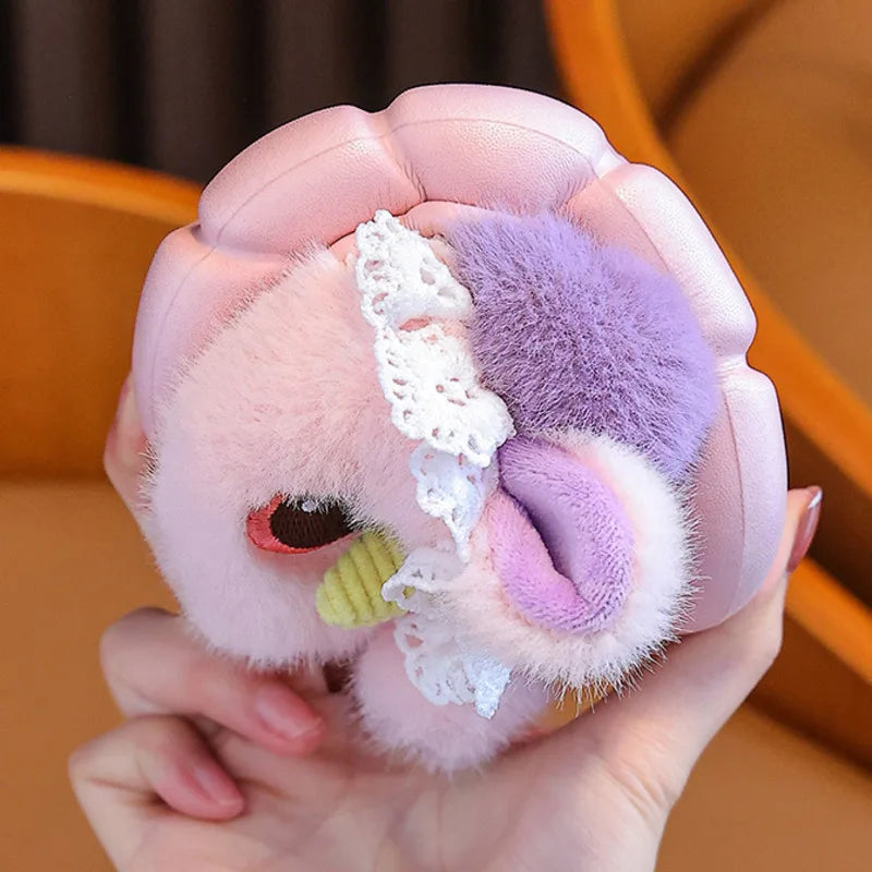 Close-up of unicorn slipper with golden horn, plush ear and white lace ruffle